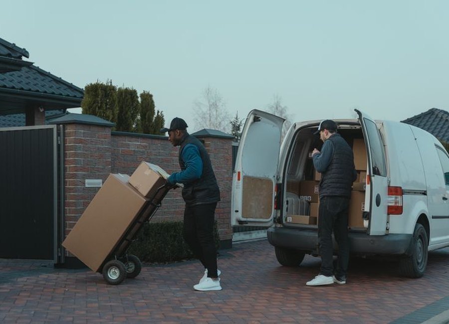 Epic Movers crew carrying furniture into a home in Denver
